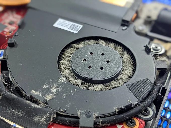 Dust clogged laptop cooling fan found during a board repair